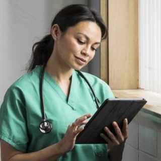 Doctor reading medical information about a patient in her care