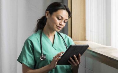 Doctor reading medical information about a patient in her care